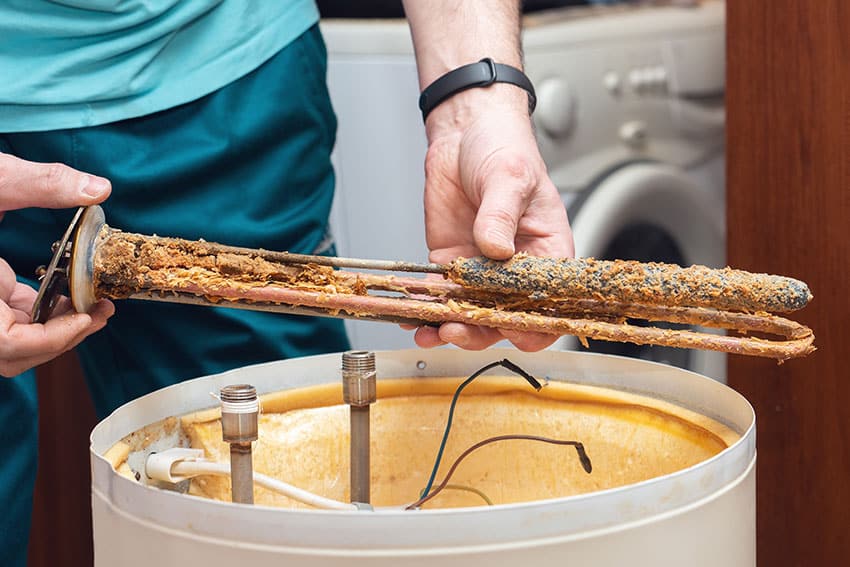 The water heating element of the boiler is covered with sediment and limescale